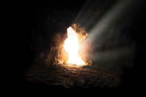 Cave mouth on a rocky mountainside at dawn, picturing an example of what could have been Elijah in a cave on Mount Horeb